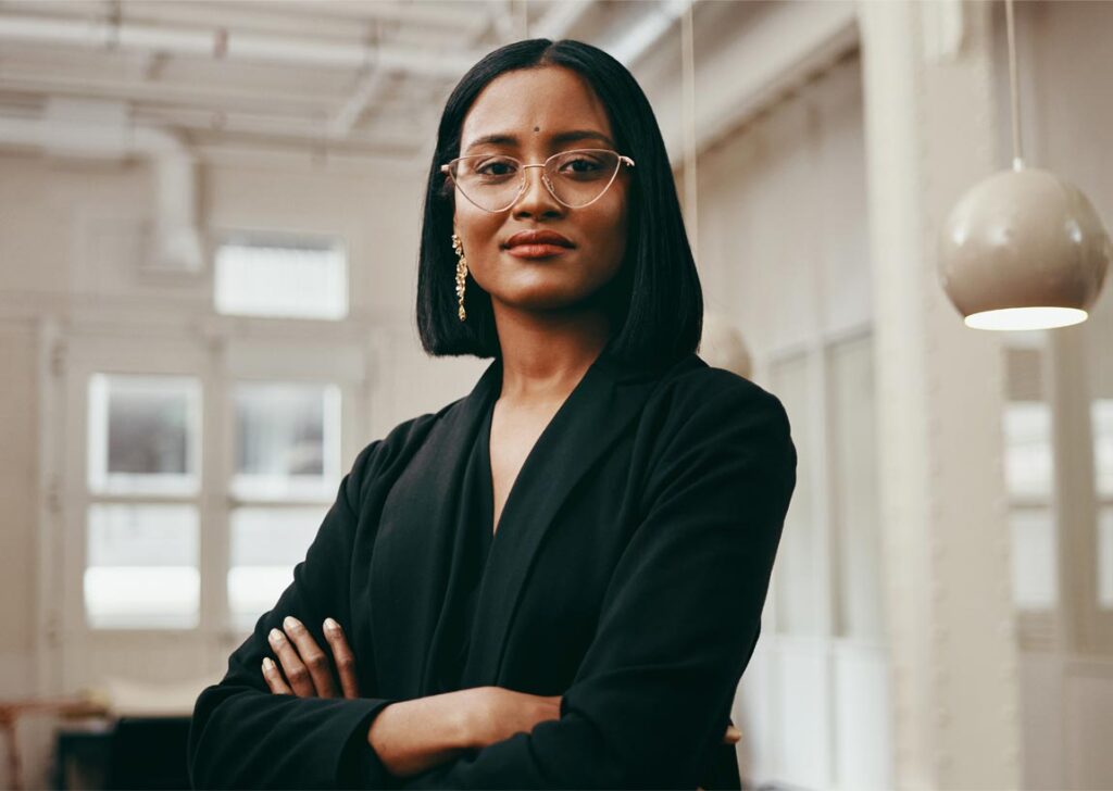African-amercian business woman with glasses looking into camera